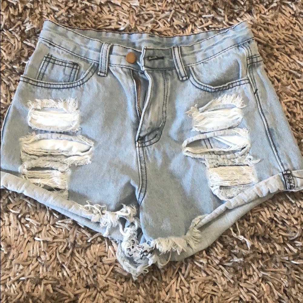 High waisted distressed blue jean shorts